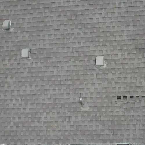 Aerial view of residential roof showing heat damage and missing shingles in San Antonio, Texas