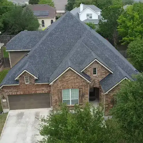 San Antonio home with professionally installed shingle roof, showing results of roof tear off vs overlay by Dolan Roofing & Construction