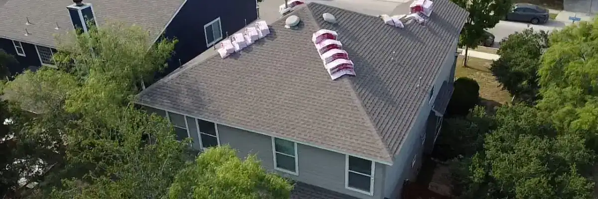 Roofing materials on-site during active storm damage repair by Dolan Roofing & Construction