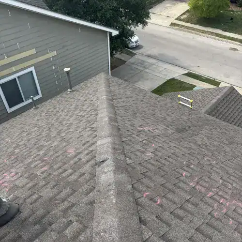 Roof inspection with marked storm damage areas highlighting repair needs by Dolan Roofing & Construction