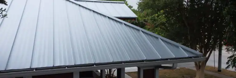 Newly installed silver metal roof on a home in San Antonio, professionally completed by Dolan Roofing & Construction, expert metal roofer San Antonio