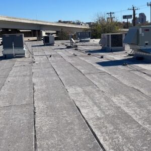 A before image of a commercial building with a Deteriorating Roof in San Antonio, TX