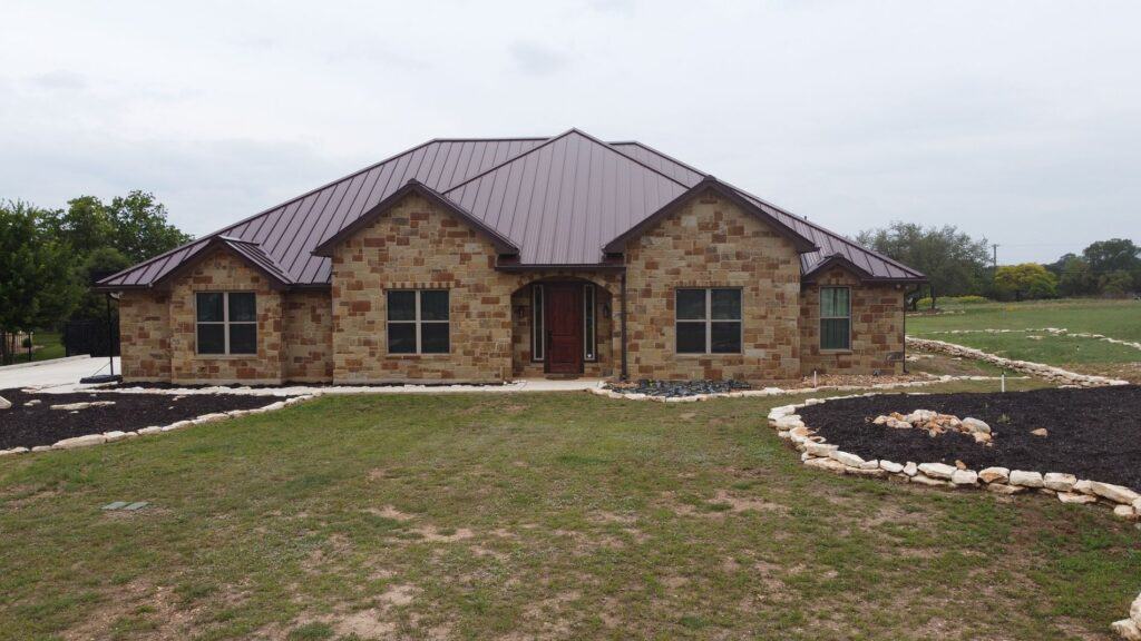 Completed metal roofing project with a reflective surface for energy efficiency by Dolan Roofing & Construction in San Antonio, TX..