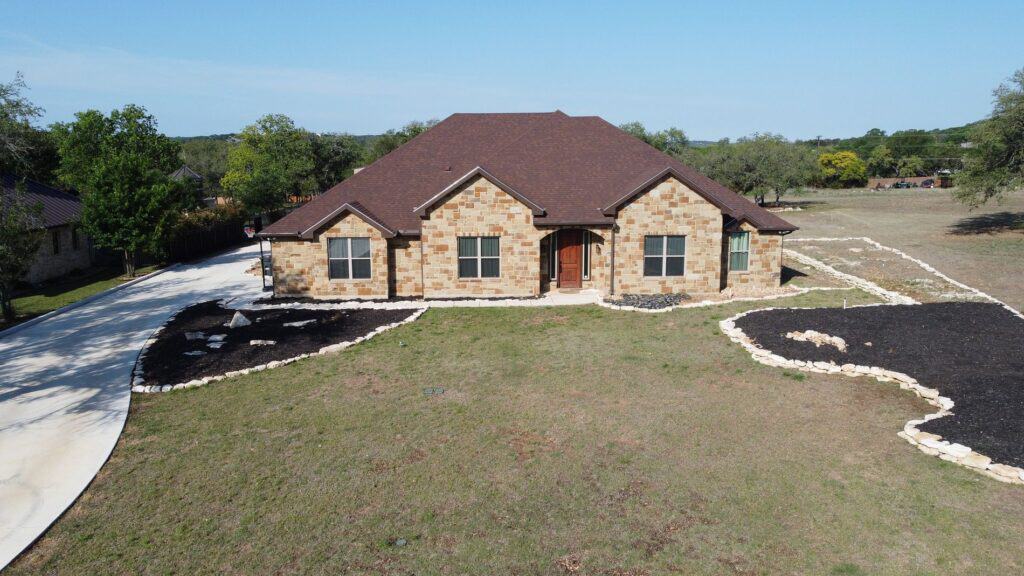 Before Completed metal roofing project with a reflective surface for energy efficiency by Dolan Roofing & Construction in San Antonio, TX.