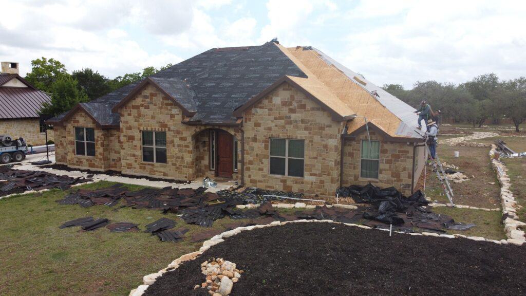 metal roof replacement in progress by Dolan Roofing & Construction in San Antonio, TX.