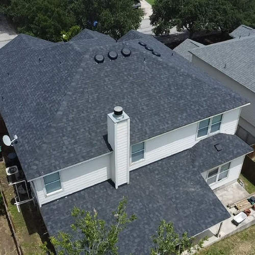 Newly installed dark shingle roof after aerial inspection for home insurance cancellation San Antonio by Dolan Roofing & Construction in San Antonio