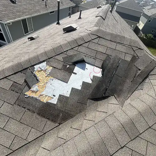 Exposed roofing underlayment after wind damage by Dolan Roofing & Construction