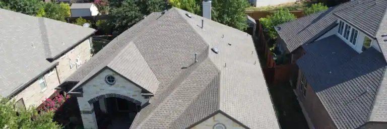 Residential roof replacement inspection with durable shingles, representing roofing companies in San Antonio TX, and honoring historical Dolan Roofing