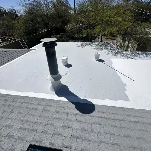 White coated flat roof installation with vent and buckets under sunny sky, showcasing best roof for flat roof in San Antonio by Dolan Roofing & Construction
