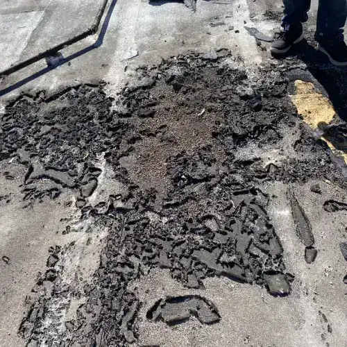 Severely damaged commercial roof surface indicating urgent need for waterproofing in San Antonio