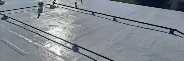 Flat commercial rooftop undergoing professional waterproofing in San Antonio by Dolan Roofing & Construction