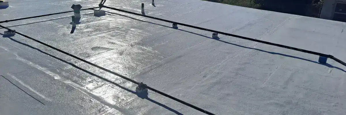 Flat commercial rooftop undergoing professional waterproofing in San Antonio by Dolan Roofing & Construction