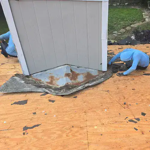Roof leak warning signs San Antonio with exposed roof decking, deteriorated flashing, and active repairs by Dolan Roofing & Construction in San Antonio