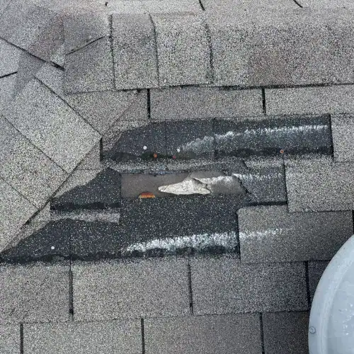 Roof leak warning signs San Antonio with missing shingles, exposed fasteners, and visible water stains by Dolan Roofing & Construction in San Antonio