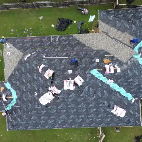 An aerial view of a roof being prepared with underlayment for a replacement by Dolan Roofing & Construction in San Antonio
