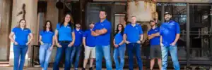 Dolan Roofing & Construction roofing contractor team standing together outside in San Antonio, showcasing professionals specializing in roof replacement San Antonio