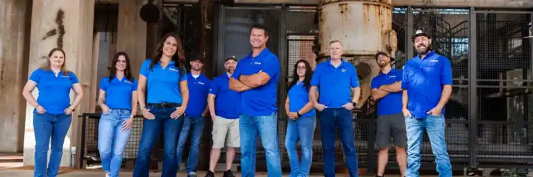 Dolan Roofing & Construction roofing contractor team standing together outside in San Antonio, showcasing professionals specializing in roof replacement San Antonio