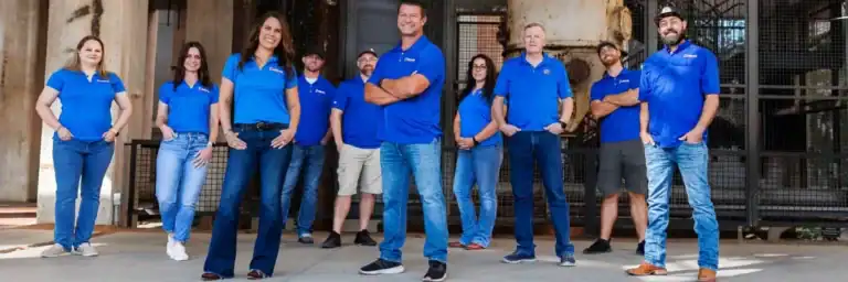 Dolan Roofing & Construction roofing contractor team standing together outside in San Antonio, showcasing professionals specializing in roof replacement San Antonio