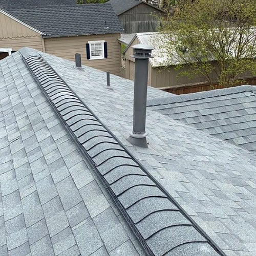 Close-up of new Owens Corning shingle roof ridge vent installed by Dolan Roofing & Construction in Alamo Heights