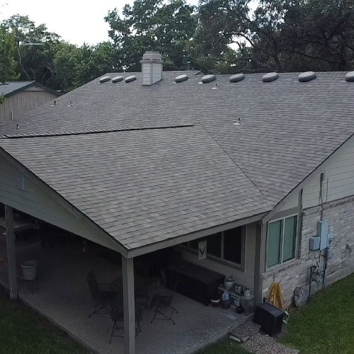 Backyard view of completed roofing project featuring Owens Corning Oakridge shingles by Dolan Roofing & Construction in Universal City