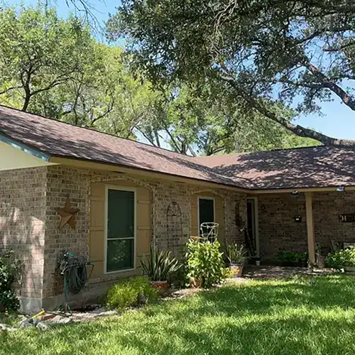 Newly repaired roof on a residential home by Dolan Roofing in Seguin, TX