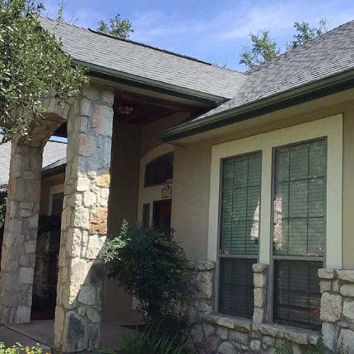 Updated front porch and roofline with new Owens Corning Oakridge shingles by Dolan Roofing & Construction in Timberwood Park