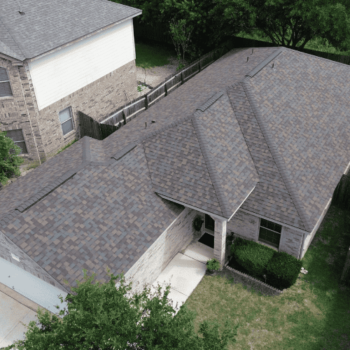Completed Owens Corning shingle roofing installation at 9931 Amberg Path by Dolan Roofing & Construction in Helotes