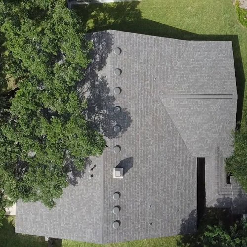 Detailed aerial view of completed roof replacement with Owens Corning shingles by Dolan Roofing & Construction in Universal City