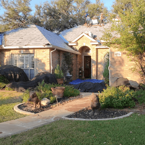 Helotes Roofing Contractor Dolan Roofing & Construction installing GAF Timberline HDZ shingles during home roof replacement at 13710 French Park in Helotes
