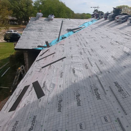 Roofing underlayment installation in progress before GAF shingle application by Dolan Roofing & Construction in Universal City