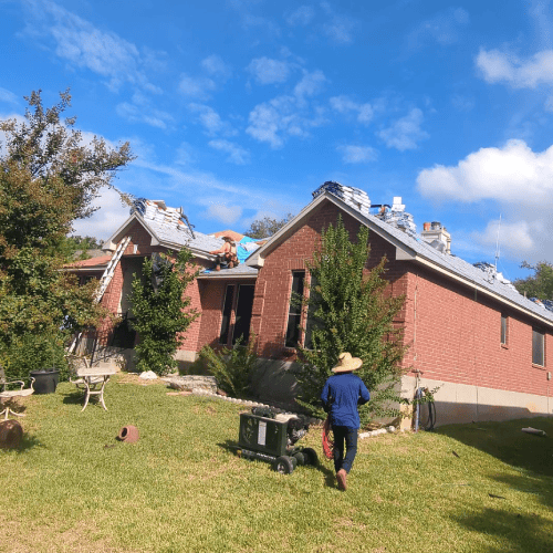 Dolan Roofing & Construction crew working on roof replacement project in Helotes