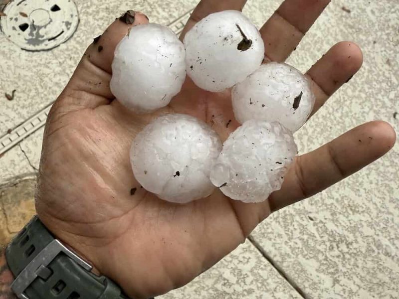 Close-up of hailstones in hand after San Antonio hail storm