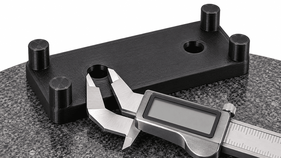 ABS electronics bracket with two M4 mounting holes and dimensional inspection