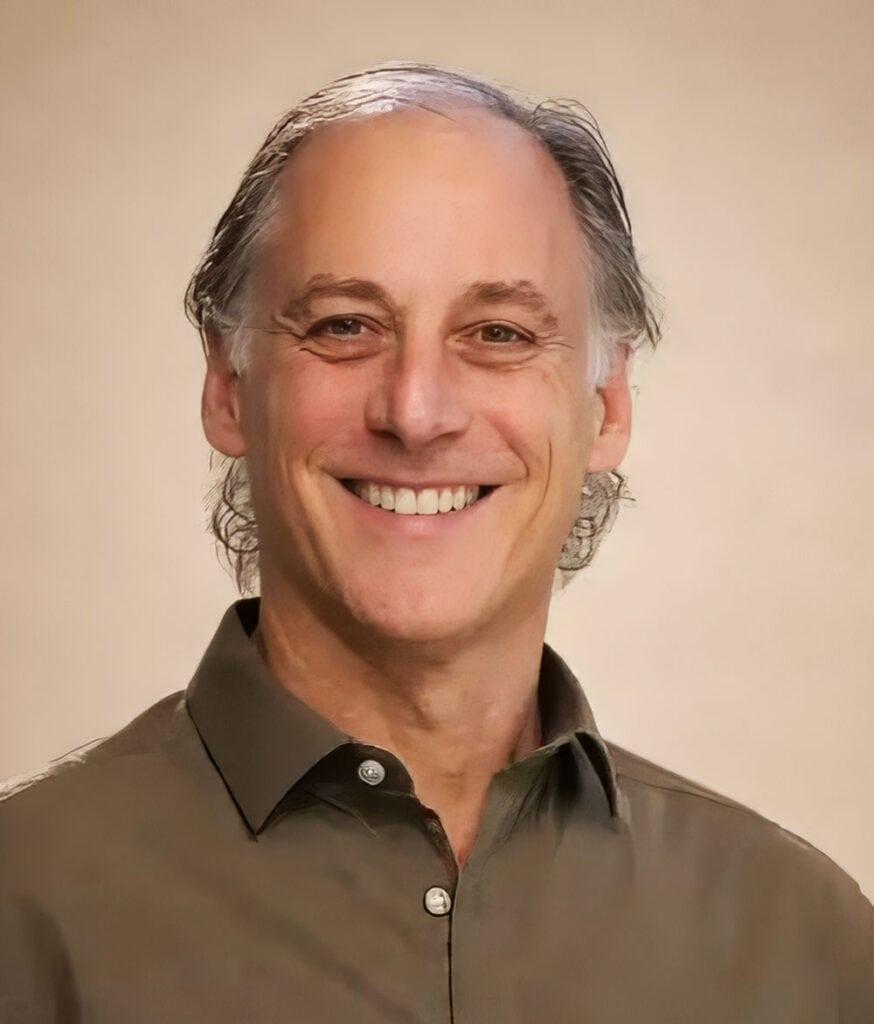 Smiling middle-aged man in professional attire for EverSpan Life.