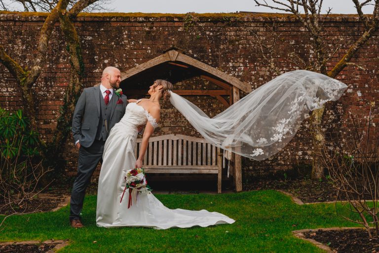 Devon wedding photographer Eyecandy Photography capturing a bride and groom at a scenic outdoor venue.