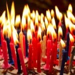 birthday cake with a lot of burning candles