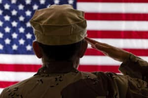 Female Soldier saluting the American Flag 