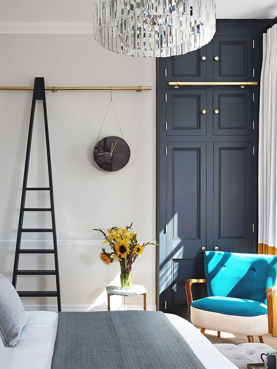 Stylish Georgian apartment interior with navy wall panels and contemporary decor.