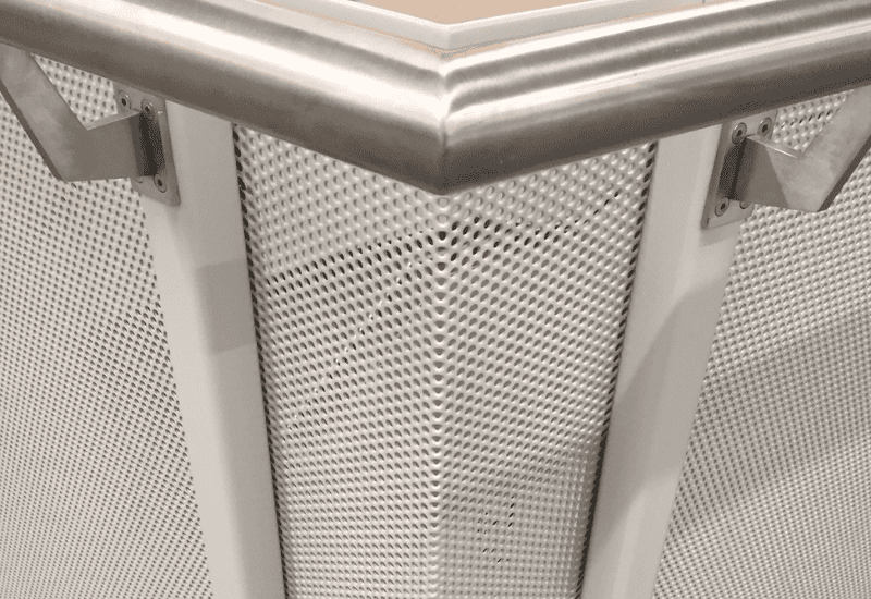 Detailing of folded perforated balustrade in white powder coated finish