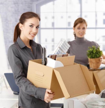 Efficient movers packing boxes with supplies for a smooth relocation process.