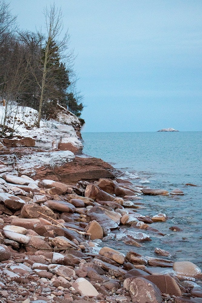 Exploring Michigan’s Upper Peninsula in Winter | A Fun Weekend Getaway Marquette shoreline covered in snow. | Michigan's Upper Peninsula