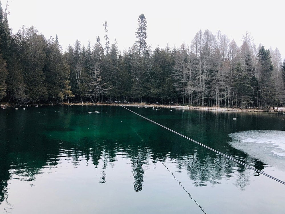 Exploring Michigan’s Upper Peninsula in Winter | A Fun Weekend Getaway Kitch-iti-kipi in Michigan's Upper Peninsula