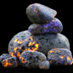 Yooperlite rocks glowing under a UV flashlight