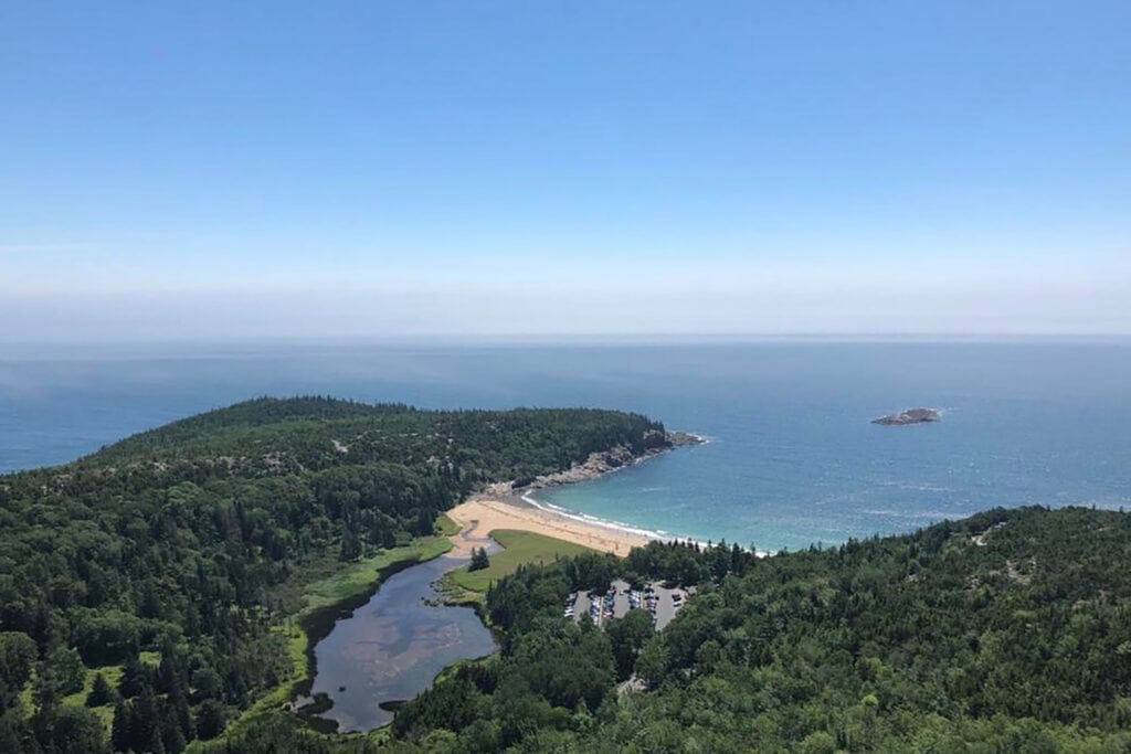 Best Hikes in Acadia National Park + Tips A view of the blue ocean from the beehive trail in Acadia national park.