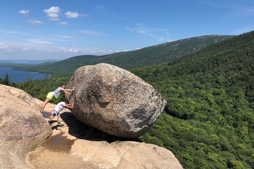 Best Hikes in Acadia National Park + Tips A view of the south bubble (large boulder on the edge of a mountain) in Acadia National Park.