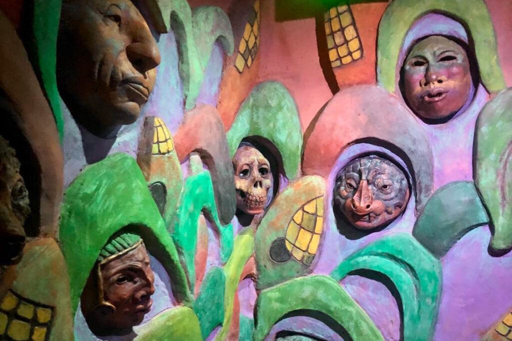 Meow Wolf Denver: The Ultimate Experience Guide for All Ages Weird colorful faces sticking out of the wall at the convergence station.