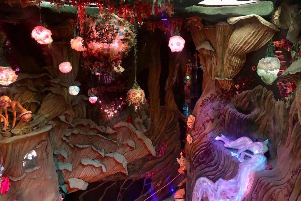 Meow Wolf Denver: The Ultimate Experience Guide for All Ages Colorful glowing treehouse at meow wolf denver