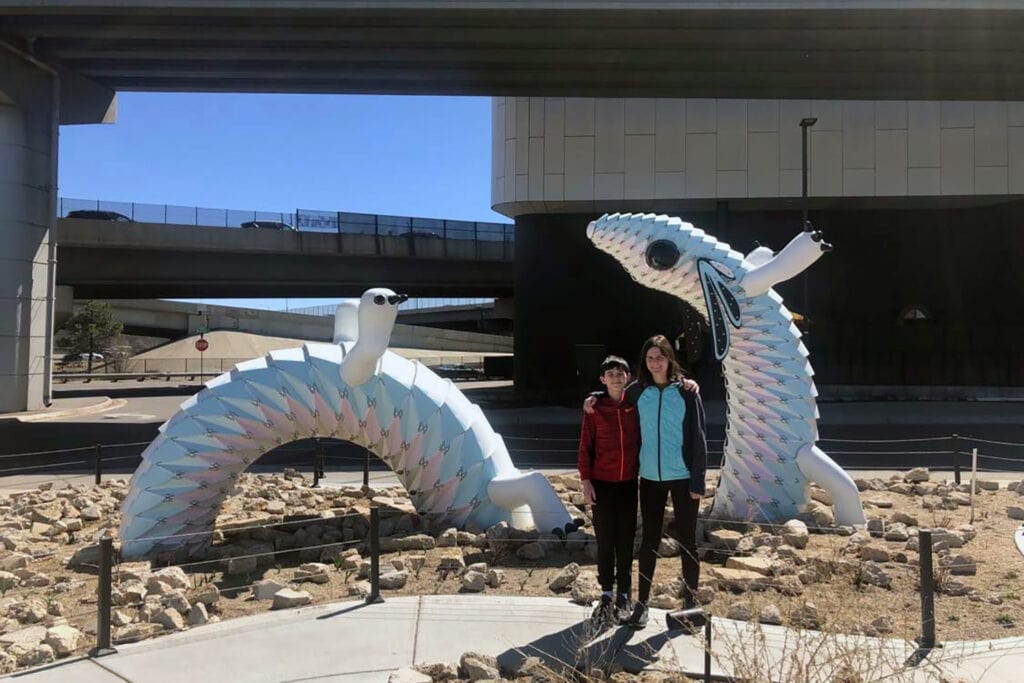 Meow Wolf Denver: The Ultimate Experience Guide for All Ages Large axolotl statue outside of Meow Wolf Denver.