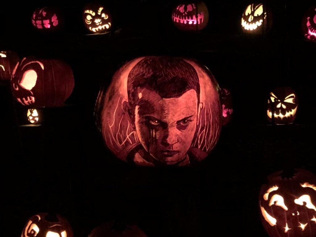 Your Guide to The Louisville Jack O’ Lantern Spectacular Eleven from Stranger Things intricately carved into a pumpkin by a very talented artist at the Louisville Jack O' Lantern Spectacular.