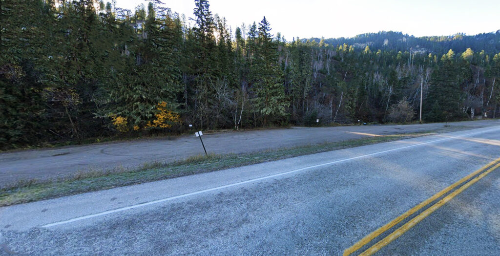 Your Ultimate Guide To Hiking Devil’s Bathtub SD Devil's Bathtub trailhead parking lot nestled in the natural surroundings of Spearfish Canyon, South Dakota.